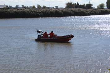 The Chatham-Kent Fire Department boat searches the Thames River using sonar technology to locate the submerged vehicle.  October 16, 2018. (Photo by Greg Higgins)