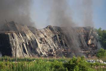 The grand stand at Windsor Raceway collapses in a fire July 1, 2015.  (Photo by Adelle Loiselle)