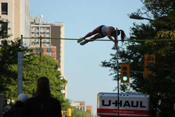 Athletes compete in a pole vaulting competition on Ouellette Ave., May 22, 2015. (Photo by Jason Viau)