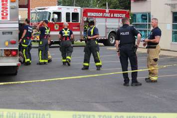 Emergency crews respond to a walk-in clinic on Tecumseh Rd. E after a car smashes through the front window, June 8, 2015. (Photo by Jason Viau)