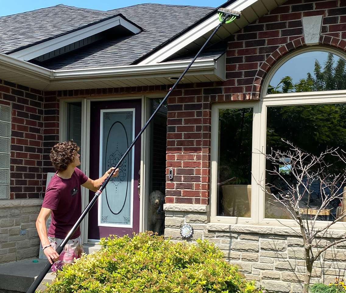 Ryan Reid of Crystal Clean Windows in Amherstburg cleans the exterior of a home for a customer. Photo submitted by the Small Business and Entrepreneurship Centre.