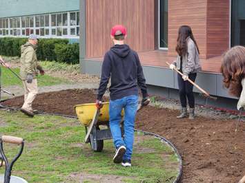 Students at GLSS in Sarnia plant a woodland habitat with help from the Golden K Kiwanis - May 5/23 (Sarnia News Today photo by Josh Boyce)