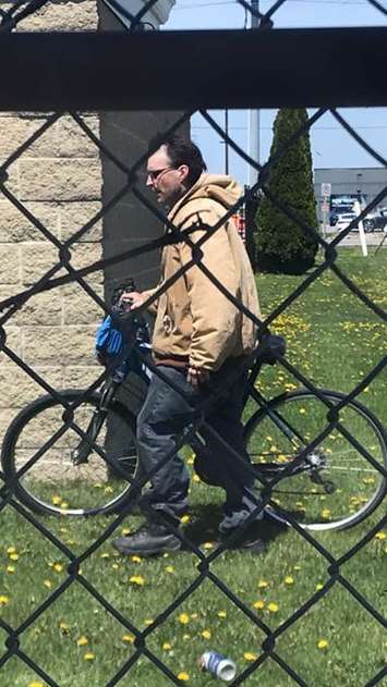 Chatham-Kent police are asking for the public's help to identify this man in connection with a mischief investigation in Chatham. (Photo courtesy of Chatham-Kent police)