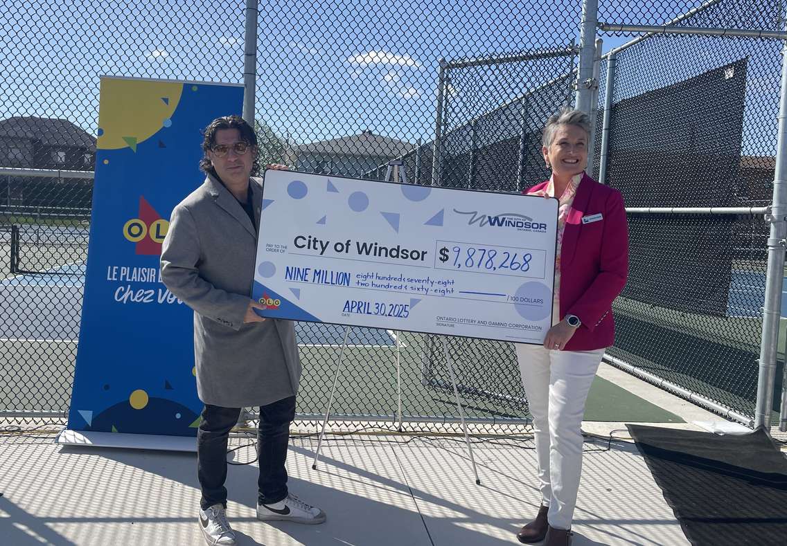 Councillor Renaldo Agostino and Kathleen Devine from the OLG celebrate last year's OLG contributions to the City of Windsor, April 30, 2025. (Photo by Maureen Revait) 
