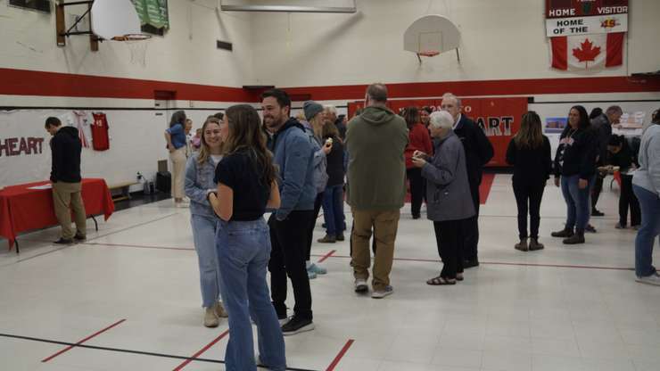 Guests in the Sacred Heart gymnasium (Photo by: Lindsay Newman/ Blackburn Media)