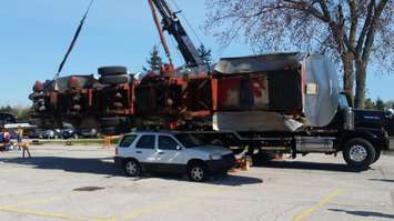 Preferred Towing dropping a fuel tanker on an SUV.  Photo by Jake Jeffrey. May 6, 2016 (blackburnnews.com)