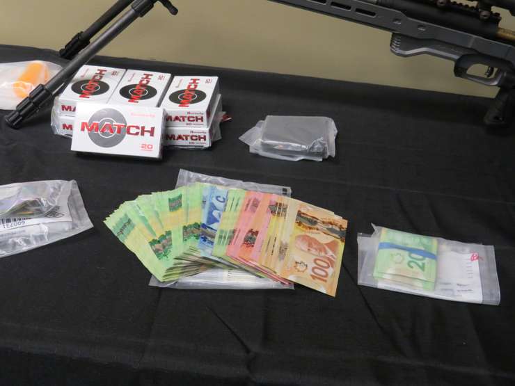 Weapons and cash seized during Project Derailleur (Photo by Tamara Thornton, Blackburn Media)