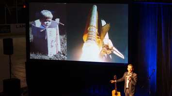 Chris Hadfield shares photo of when he was young, dreaming of becoming an astronaut, during a keynote address in Sarnia.  May 25, 2016 (BlackburnNews.com Photo by Briana Carnegie)