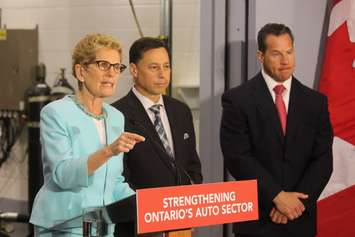 Ontario Premier Kathleen Wynne, left,  Minister of Economic Development Brad Duguid and FCA CEO Reid Bigland, right, at Chrysler's research centre in Windsor, June 15, 2016. (Photo by Jason Viau)