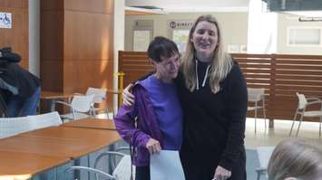 Dr. Hayley Wickenheiser meets an emotional fan at Bluewater Health's Sarnia site. May 18, 2023. (Photo by Natalia Vega)