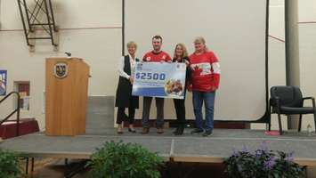 Tyler McGregor holds a cheque for $2500 from RBC to North Lambton Secondary School. April 3, 2018. (Photo by Colin Gowdy, Blackburn News)