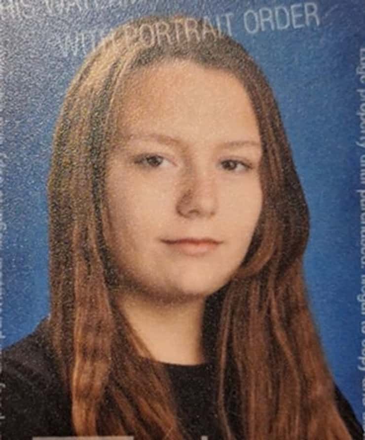 a 13 year old girls headshot on blue background
