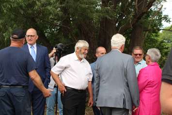 Windsor Mayor Drew Dilkens, left, Lakeshore Mayor Tom Bain, and Leamington Mayor Hilda MacDonald, right in pink jacket, in Leamington, August 12, 2019. Photo by Mark Brown/Blackburn News.