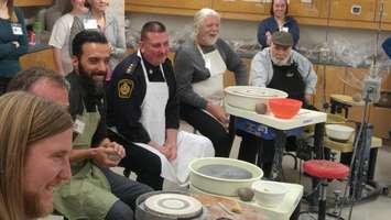 Local celebrities being instructed on how to create their pottery bowls. February 23, 2018. (Photo by Colin Gowdy, Blackburn News)
