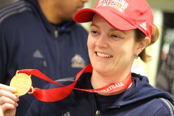 Windsor Lancers women's basketball head coach Chantal Vallee arrives at Windsor airport after winning a fifth-straight national championship. (Photo by Jason Viau)