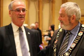 Lakeshore Mayor Tom Bain (R) and LaSalle Mayor Ken Antaya (L) pose for photos after Bain is re-elected as county warden and Antaya is elected deputy warden on December 10, 2014. (Photo by Ricardo Veneza)