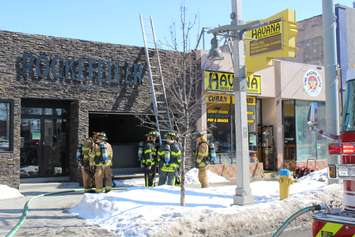 Windsor firefighters respond to a blaze at Havana Smoke Shop & Convenience in the 500-block of Ouellette Ave. downtown, February 23, 2015. (Photo by Mike Vlasveld)