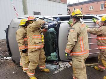 Fire crews work to extricate the driver from a pickup truck, following a rollover crash in Delhi, January 18, 2019. (Photo courtesy of the OPP via Twitter)