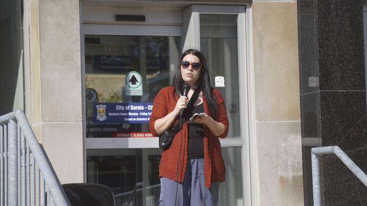 Jordon D'Arcy spoke outside of city hall at the Stand up Against Poverty rally. October 18, 2024. (Photo by Natalia Vega) 