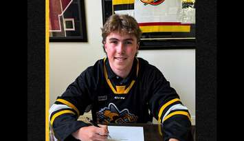 Cameron Aucoin signs with the Sarnia Sting (Photo courtesy of Sarnia Sting via Facebook)