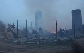 Area fire departments battle blaze at dairy farm in Tecumseh, April 18, 2016. (Photo by Maureen Revait) 