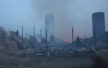Area fire departments battle blaze at dairy farm in Tecumseh, April 18, 2016. (Photo by Maureen Revait) 