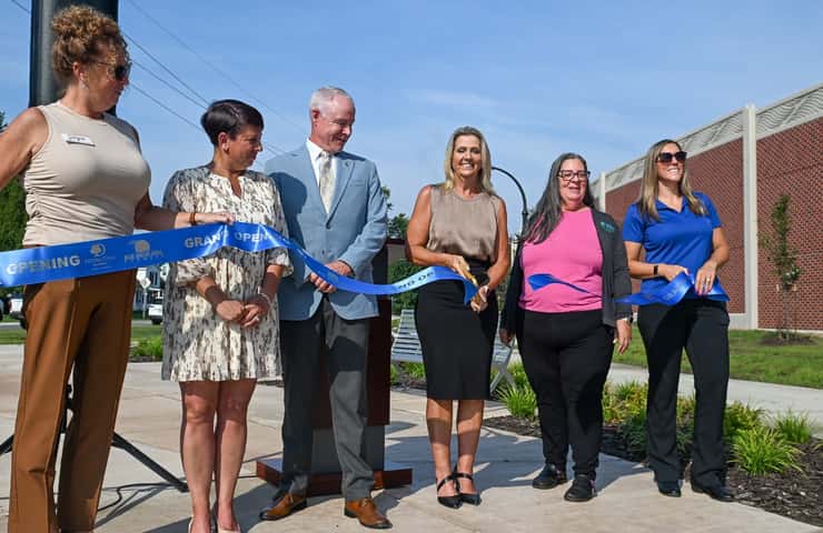 Local officials and MDOT staff celebrate the opening of the Scott Avenue path and greenspace with a ribbon-cutting celebration. Photo courtesy of MDOT.
