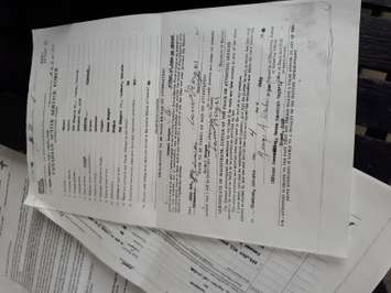 A copy of the attestation papers for Samuel Berger is displayed on May 17, 2019. Photo by Mark Brown/Blackburn News.