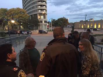 Sarnia Police escort a man out of Sarnia City Hall. Monday, October 24, 2016. BlackburnNews.com photo by Melanie Irwin