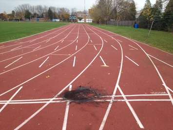 Photo of apparent burn mark on  Sarnia Central Athletics track. Nov. 4, 2014 (photo by Jake Jeffrey blackburnnews.com)