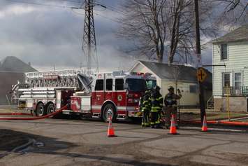 Windsor firefighters battle a blaze in the 800-block of Wellington Ave., January 27, 2016. (Photo by Mike Vlasveld)