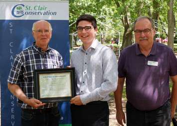 Kevin Robertson is awarded with the A.W. Campbell Memorial Scholarship by St. Clair Region Conservation Authority Vice-Chair, Larry Gordon (left) and Chair, Joe Faas (right).