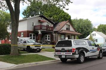 Police and fire officials investigate a fatal fire on Aubin Rd., August 12, 2015. (Photo by Jason Viau)