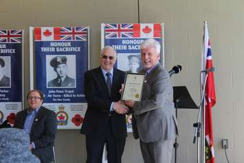 MPP for Chatham-Kent-Essex Rick Nicholls presenting a certificate to commemorate 100 years. April 5, 2017. (Photo by Natalia Vega)