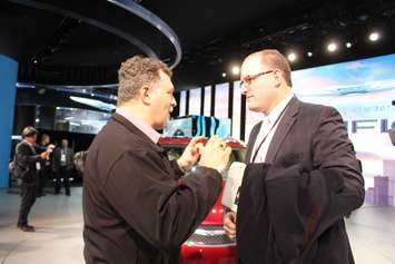 Unifor Local 444 President Dino Chiodo and Windsor Mayor Drew Dilkens at the unveiling of the Chrysler Pacifica at the North American International Auto Show 2016. (Photo by Maureen Revait) 
