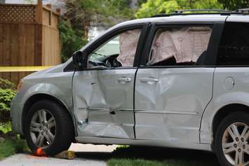 Windsor police investigate a crash involving a motorcycle and van at the intersection of Chilver Rd. and Richmond St., June 4, 2015. (Photo by Jason Viau)