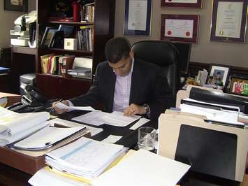 BlackburnNews.com file photo, Windsor Mayor Eddie Francis working in his office.