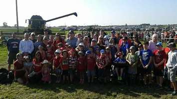 Students from St. James School in Seaforth welcome the Prime Minister. (Photo by Adam Bell)