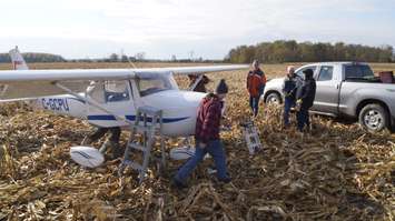 Windsor Flight Club members, including John Cundle, work to take the wings off the aircraft that made an emergency landing in Sarnia last week. October 31, 2017 (Photo by Melanie Irwin)