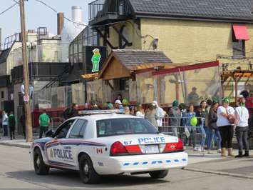 London police keeping an eye on St. Patrick's Day partiers on Richmond Row, March 17, 2017. (Photo by Miranda Chant, Blackburn News.)