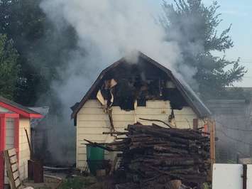 Firefighters battle a shed fire on Deer Run Rd. in Leamington, August 28, 2016. (Photo courtesy of Leamington Fire Services)