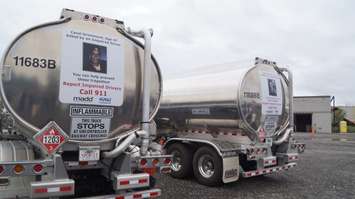 The decals of two impaired driving victims unveiled on the backs of Westcan trucks. October 4, 2018. (Photo by Colin Gowdy, BlackburnNews)