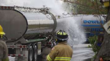 Firefighters spraying two haulers during the 2019 Sarnia Area Disaster Simulation. May 22, 2019. (Photo by Colin Gowdy, BlackburnNews)