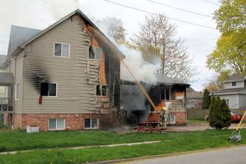 Firefighters battle a house fire in the area of Grant Street and Chatham Street in Chatham, May 8, 2019. (Photo courtesy of 	John Revell) 