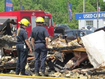London firefighters examine the rubble left after a massive fire at the former Hook's Restaurant at Wharncliffe and Southdale, May 30, 2018. (Photo by Miranda Chant, Blackburn News) 