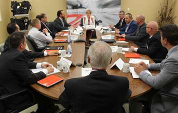 Ontario Premier Kathleen Wynne holds an auto manufacturing round table at Magna Closures in Windsor, June 19, 2015. (Photo by Mike Vlasveld)