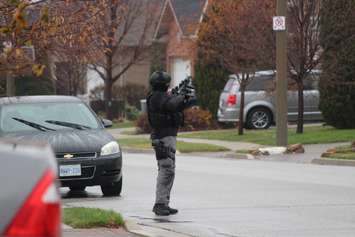 Windsor police ESU surround house in east Windsor to serve an outstanding arrest warrant, December 1, 2015. (Photo by Maureen Revait) 
