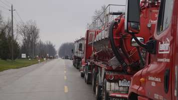 A line of trucks unable to access Clean Harbors' Corunna site due to picketers.  25 November 2021.  (SarniaNewsToday.ca photo)