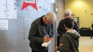 Former Toronto Maple Leafs Captain Rick Vaive signs autographs at the We're All Stars Celebration in London, February 23, 2016. Photo by Miranda Chant.