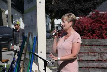 Habitat for Humanity executive director Nancy McDowell addresses dozens of people who were on hand for the ground-breaking ceremony at 97 Woods Street on Thursday. (Photo by Michael Hugall)